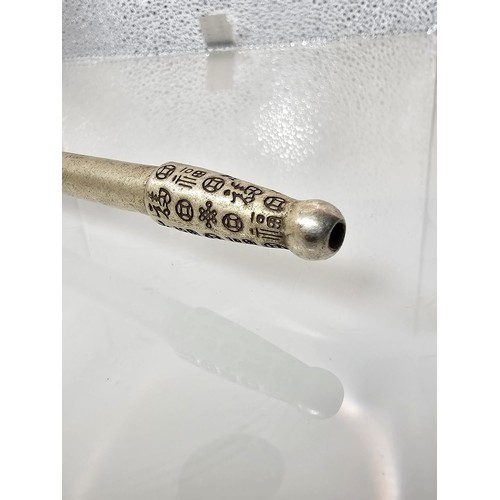 386 - An impressive ornate white metal long Asian Smoking Pipe having a jewelled design to the centre of t... 