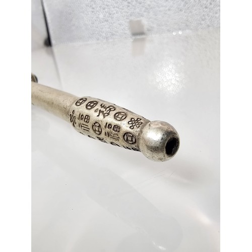 386 - An impressive ornate white metal long Asian Smoking Pipe having a jewelled design to the centre of t... 