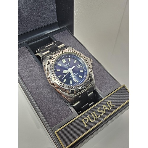 387 - 2x good quality cased gents wrist watches to include a Pulsar Solar Diver 200M wristwatch Model V145... 