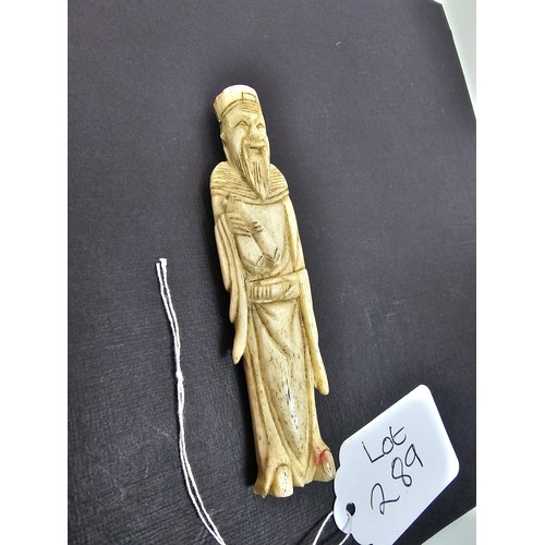 289 - A very well carved bone figure of an Asian man it presents excellent carving throughout. The figure ... 