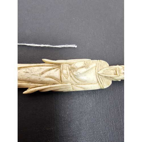 289 - A very well carved bone figure of an Asian man it presents excellent carving throughout. The figure ... 