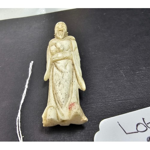 289 - A very well carved bone figure of an Asian man it presents excellent carving throughout. The figure ... 