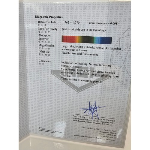 406 - A fine quality 18ct Gold Ruby & Diamond Halo Ring. Claw set with an oval cut natural Ruby weighing 0... 