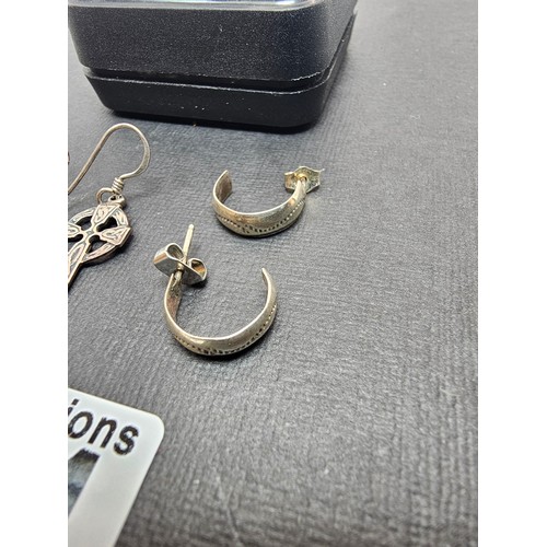 291 - 2x pairs of 925 Silver earrings to include a pair of drop earrings with a Celtic Cross design and a ... 