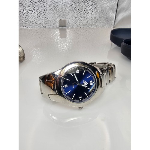 295 - A collection of 4x Sports Wristwatches to include an attractive Chrome Adidas cased wristwatch, a Ti... 