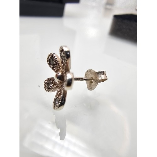 300 - 2x pairs of as new 925 Silver stud earrings. Both are flower formed. One pair is set with Tigers Eye... 