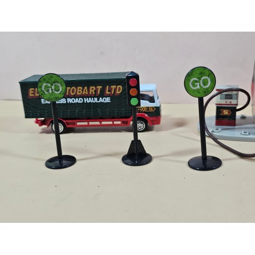 167 - A small collection of Eddie Stobart diecast vehicles to include a curtain side lorry with spare curt... 