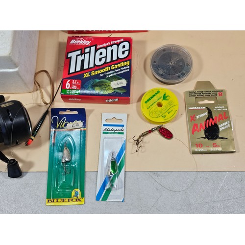 178 - A boxed Abu 50g auto sync reel along with a quanitity of fishing accessories to include fishing line... 