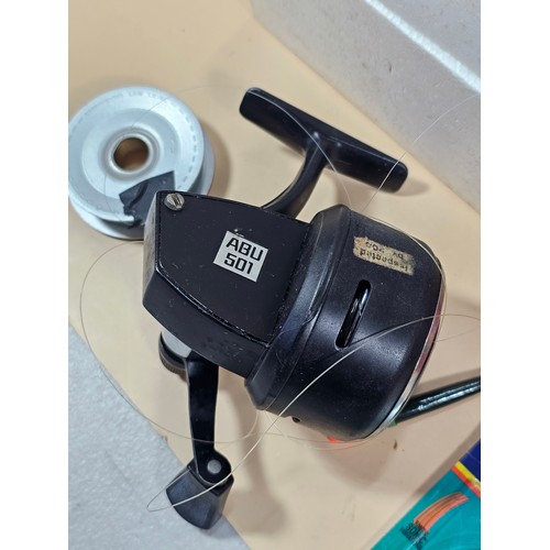178 - A boxed Abu 50g auto sync reel along with a quanitity of fishing accessories to include fishing line... 
