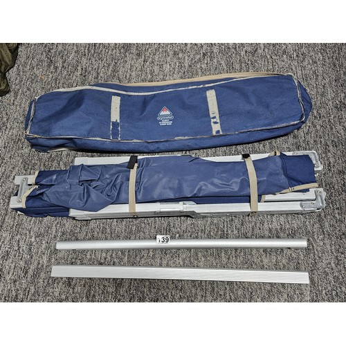 139 - A good quality Wynnster aluminium camp bed in good order complete with carry case