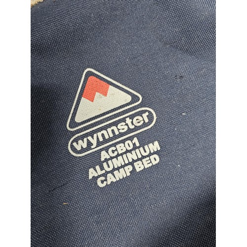 139 - A good quality Wynnster aluminium camp bed in good order complete with carry case