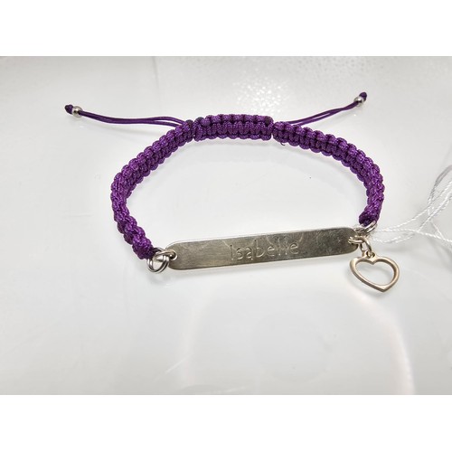329 - A braided cord 925 Silver length adjustable bracelet having a 925 Silver plaque marked Isabelle with... 