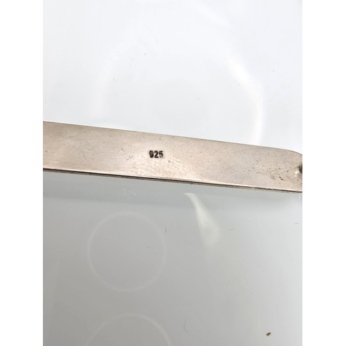 329 - A braided cord 925 Silver length adjustable bracelet having a 925 Silver plaque marked Isabelle with... 