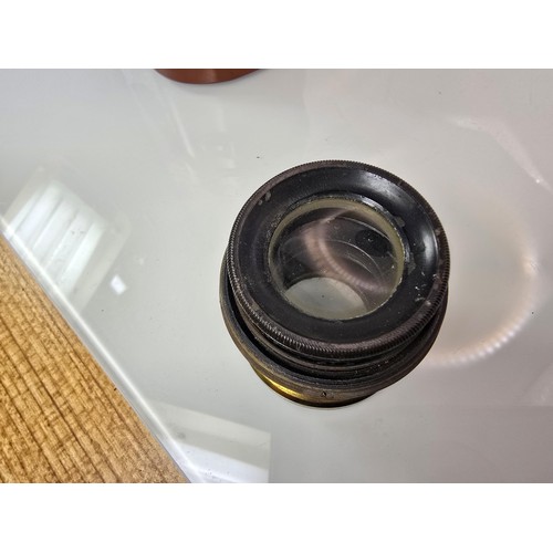 274 - A late 19th century antique Beck symmetrical brass camera lens complete with its original leather ca... 