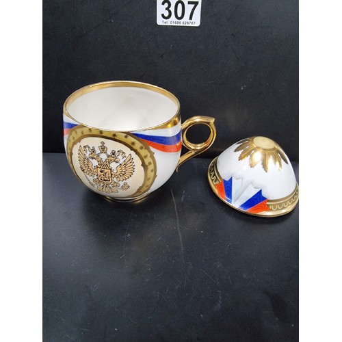 276 - A rare collectable Russian porcelain egg teacup and lid, it is decorated with a Russian flag motif a... 