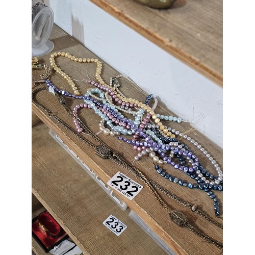 232 - A small quantity of costume jewellery to include beaded necklaces, a metal bracelet with enamel pict... 