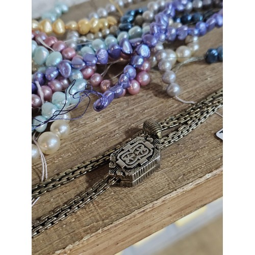 232 - A small quantity of costume jewellery to include beaded necklaces, a metal bracelet with enamel pict... 