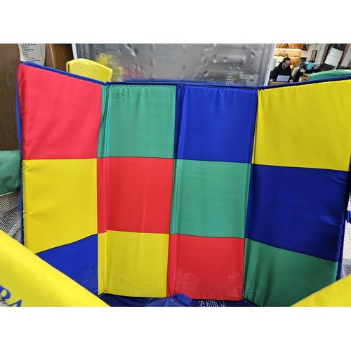 487 - Pack & play compact childs playpen in bright primary colours, complete with carry case. Playpen open... 