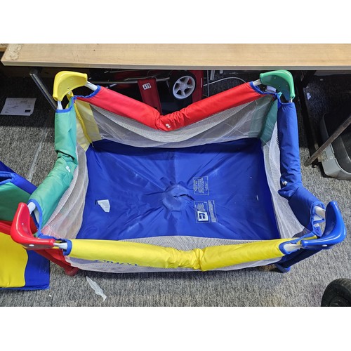 487 - Pack & play compact childs playpen in bright primary colours, complete with carry case. Playpen open... 