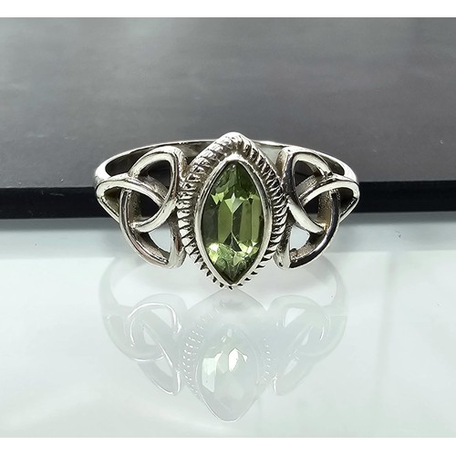 345 - A brand new pretty 925 Silver ring set with a marquise cut peridot gemstone having a trinity symbol ... 