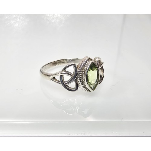 345 - A brand new pretty 925 Silver ring set with a marquise cut peridot gemstone having a trinity symbol ... 