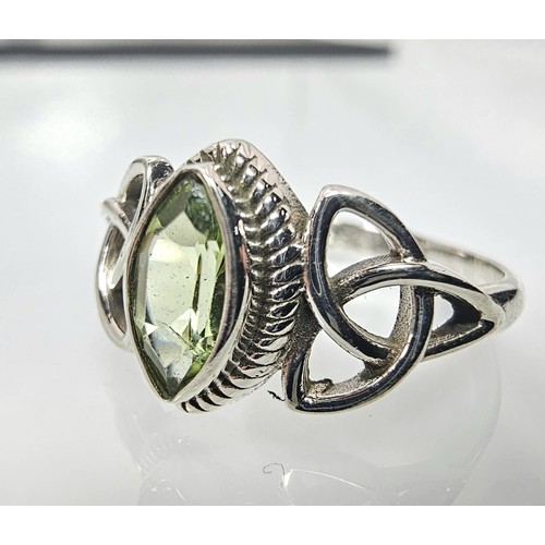 345 - A brand new pretty 925 Silver ring set with a marquise cut peridot gemstone having a trinity symbol ... 