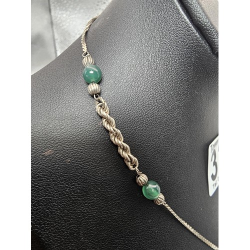 339 - 2x 925 Silver necklaces to include an interesting silver necklace with an middle eastern design feat... 