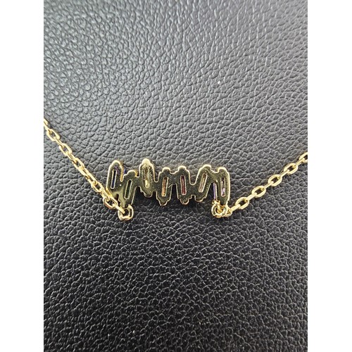 338 - An as new gold on 925 silver pretty necklace set with seven genuine baguette cut gemstones to includ... 