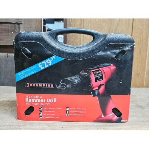 511 - Champion 18v cordless hammer drill 9647 complete with 2x batteries and charging dock - model SKU0075... 
