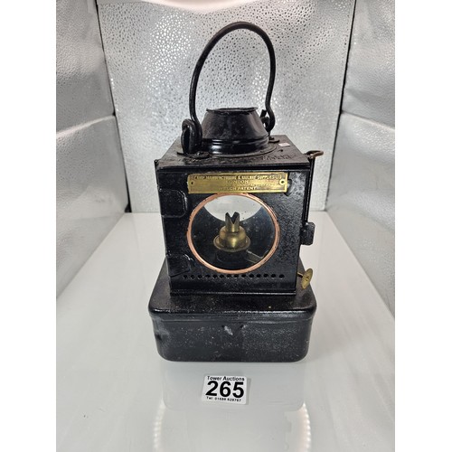 265 - An early 20th century British railway signal lamp of square section blackened metal construction wit... 