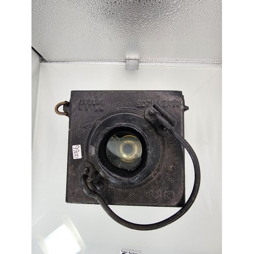 265 - An early 20th century British railway signal lamp of square section blackened metal construction wit... 