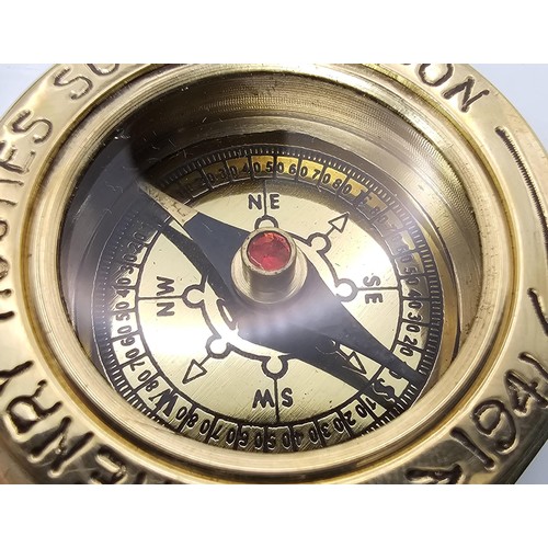 275 - A good modern brass reproduction compass marked Henry Hughes son ltd London 1941, the back is marked... 