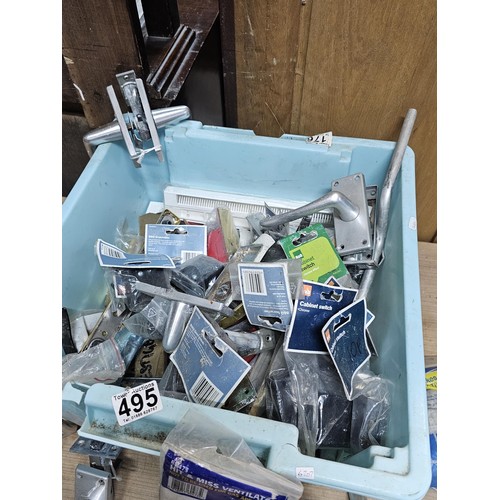 495 - A box containing a large quantity of assorted shed odds to include door handles and locks, main circ... 