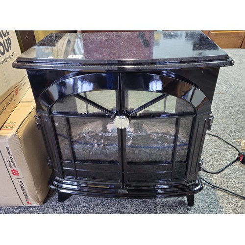 527 - Good quality dimplex electric heater complete with backlight and wood fire effect has 2x arched door... 