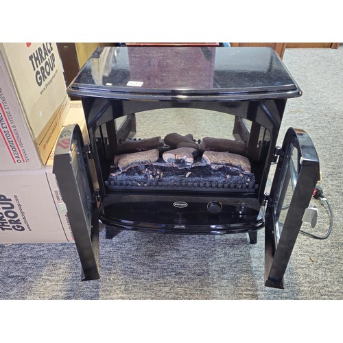 527 - Good quality dimplex electric heater complete with backlight and wood fire effect has 2x arched door... 