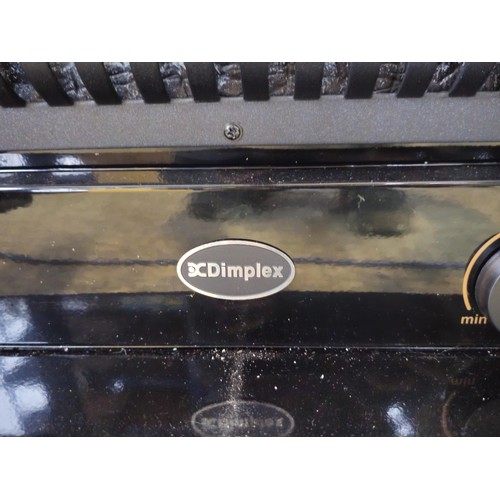 527 - Good quality dimplex electric heater complete with backlight and wood fire effect has 2x arched door... 