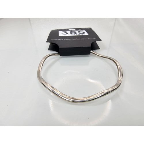 355 - A brand new Next sterling silver bangle with a wave shaped design along with a brand new Next sterli... 