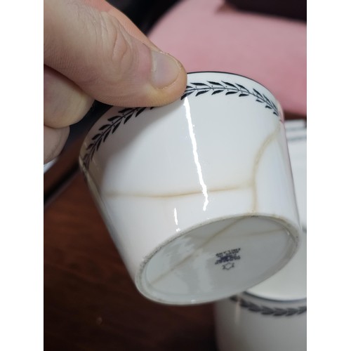 551 - A vintage Paragon 15 piece teaset in black and white with a garland design to the top, consisting of... 