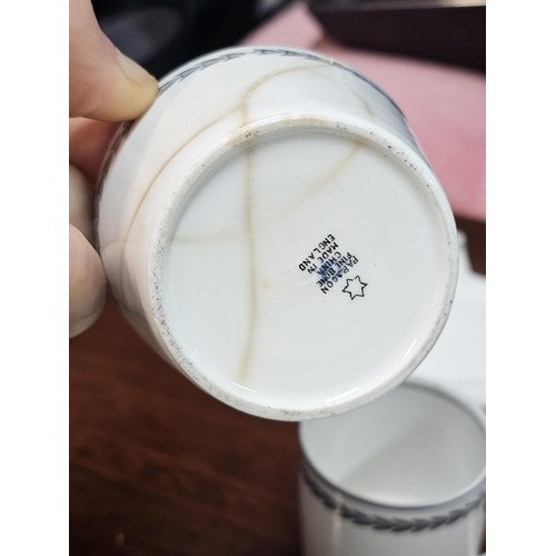 551 - A vintage Paragon 15 piece teaset in black and white with a garland design to the top, consisting of... 