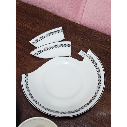 551 - A vintage Paragon 15 piece teaset in black and white with a garland design to the top, consisting of... 