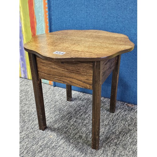 554 - A good quality vintage scalloped wooden sewing table with lift up lid in oak, the lid lifts to a fit... 