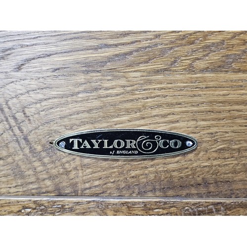 555 - A good quality vintage Taylor & Co, solid oak 4 division wine rack in good order showing little sign... 