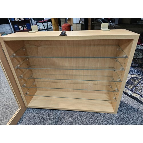 461 - An as new modern beech wall hanging shelf unit with 5 glass shelves and large clear beech framed gla... 