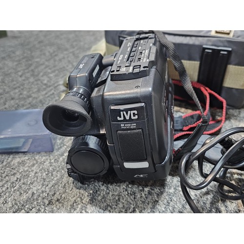 462 - A compact VHS portable video recorder complete with charger and spare tape, along with a  Agfa clack... 