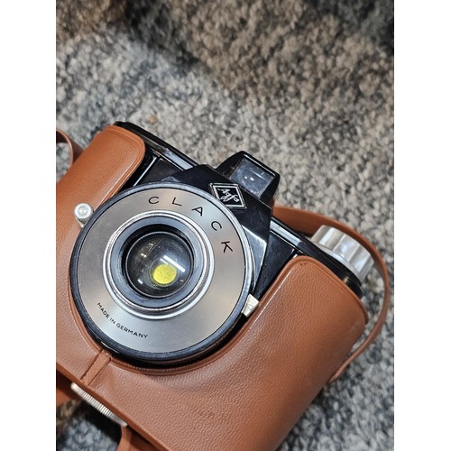 462 - A compact VHS portable video recorder complete with charger and spare tape, along with a  Agfa clack... 