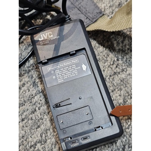 462 - A compact VHS portable video recorder complete with charger and spare tape, along with a  Agfa clack... 