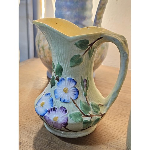 261 - A shelf full of collectable ceramics and earthenware to include 2 handmade salt sellers in the form ... 