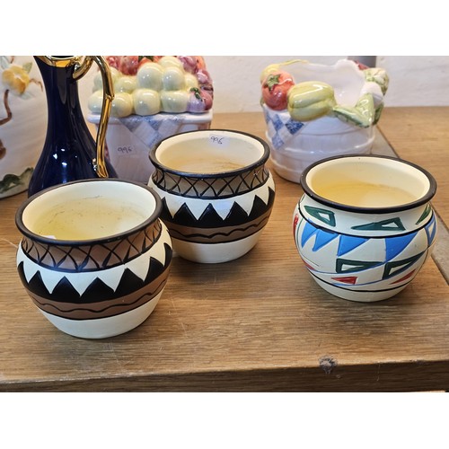 261 - A shelf full of collectable ceramics and earthenware to include 2 handmade salt sellers in the form ... 