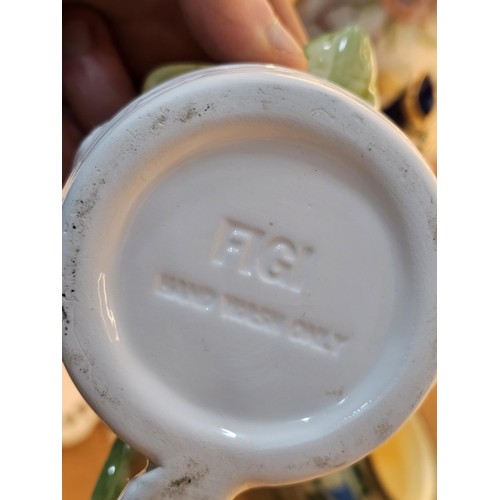 261 - A shelf full of collectable ceramics and earthenware to include 2 handmade salt sellers in the form ... 