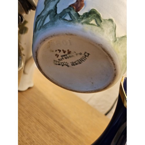 261 - A shelf full of collectable ceramics and earthenware to include 2 handmade salt sellers in the form ... 